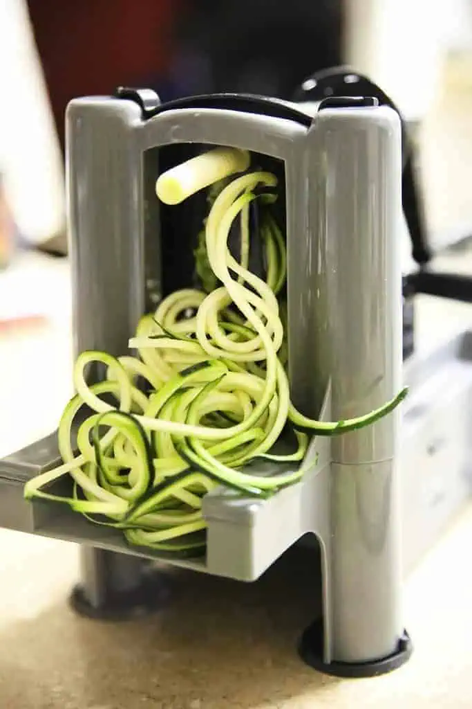 peeling zucchini for making zucchini noodles