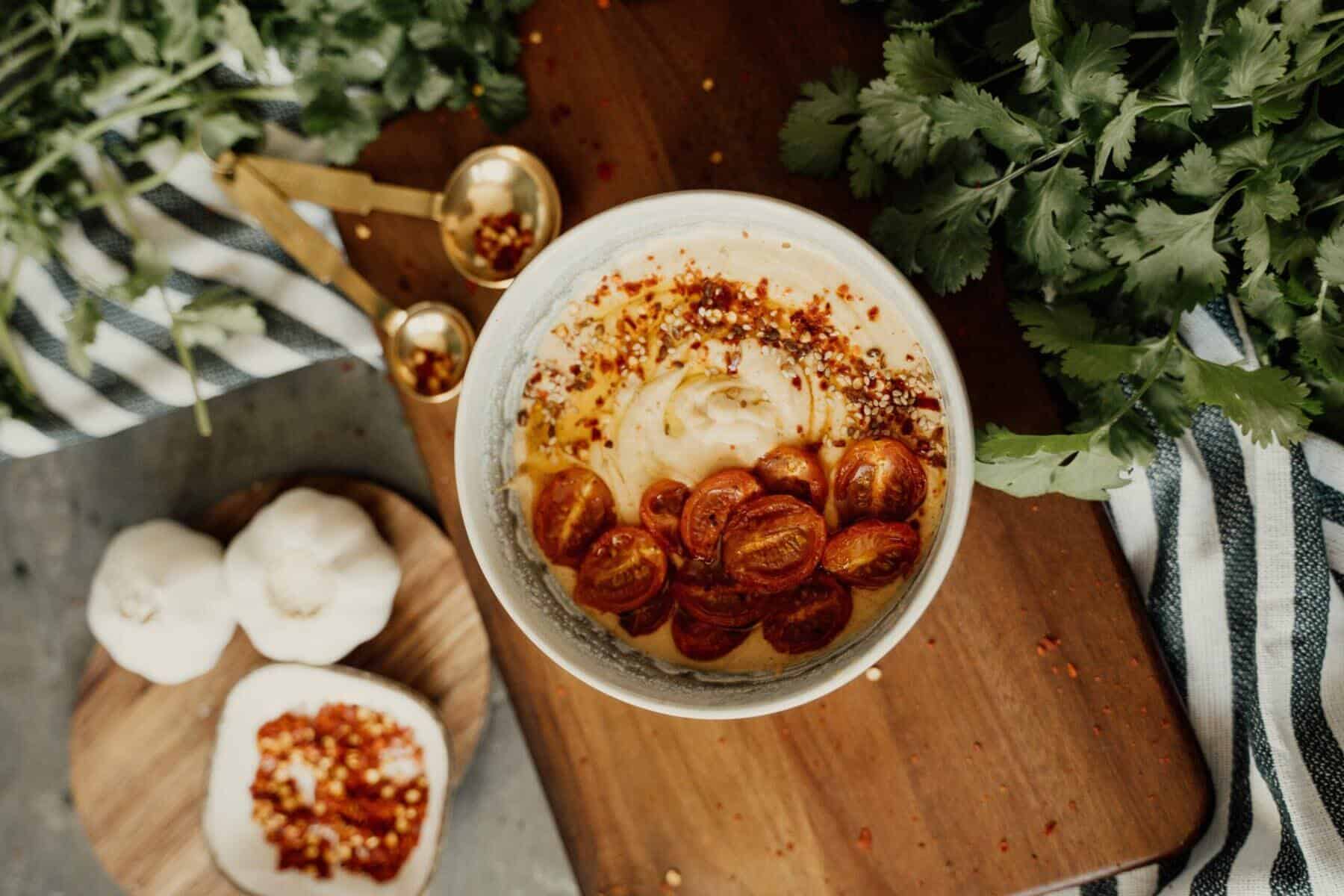 Photo of a bowl spread on top of wooden chopping board