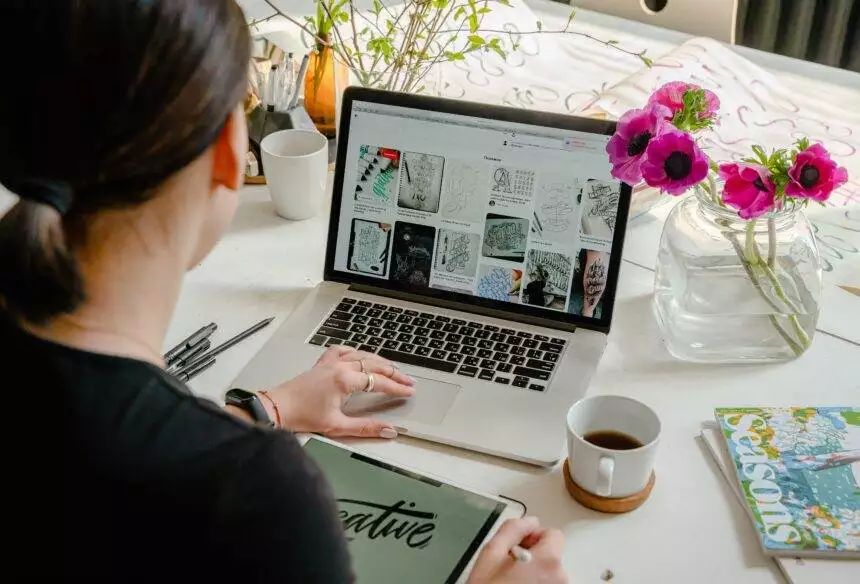 Professional woman working on web design at home office.
