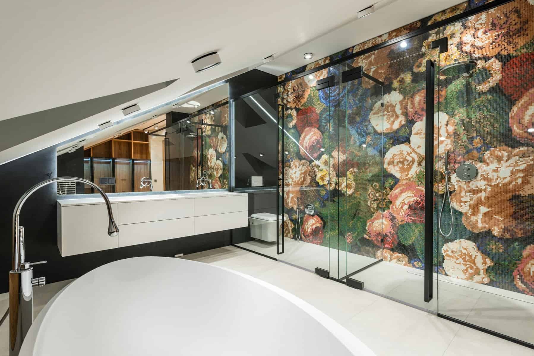 Elegant bathroom featuring a glass shower enclosure and a floral mural wall.