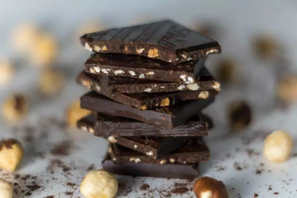 piles of dark chocolate bars stacked