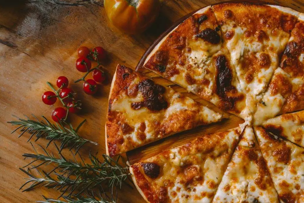 delicious pizza slices kept on a plate