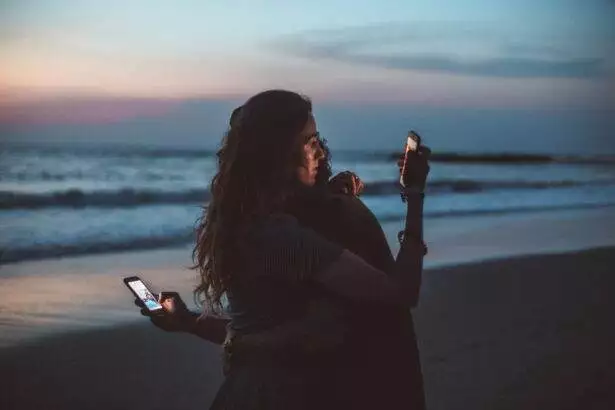 couple on their phones