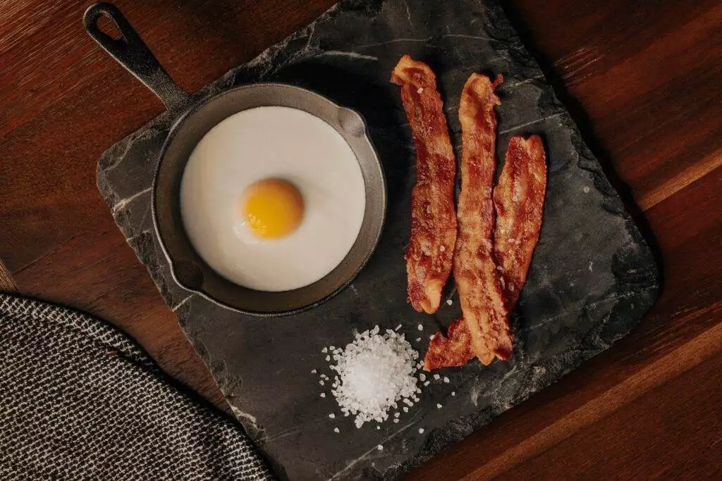 cooked bacon served on a plate