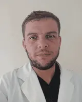 Doctor in white coat with stethoscope, healthcare professional portrait.