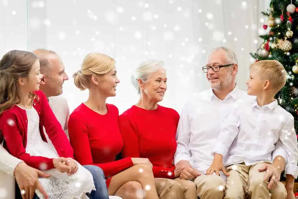 smiling family sitting and talking at home