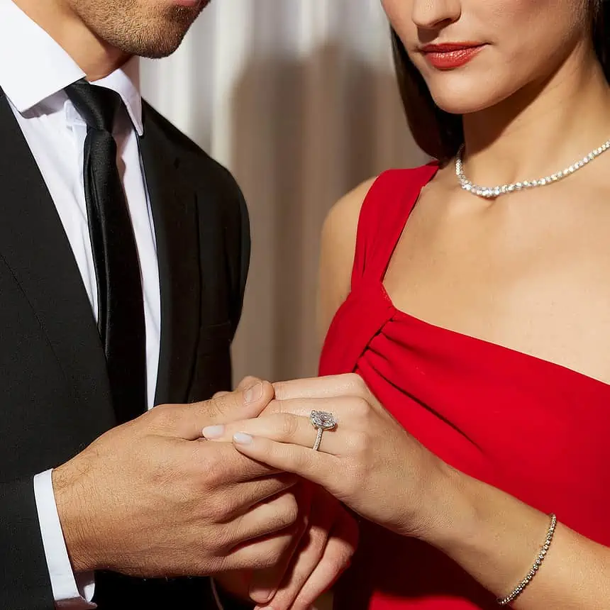Close-up of a couple holding hands during a wedding, showcasing love and commitment.
