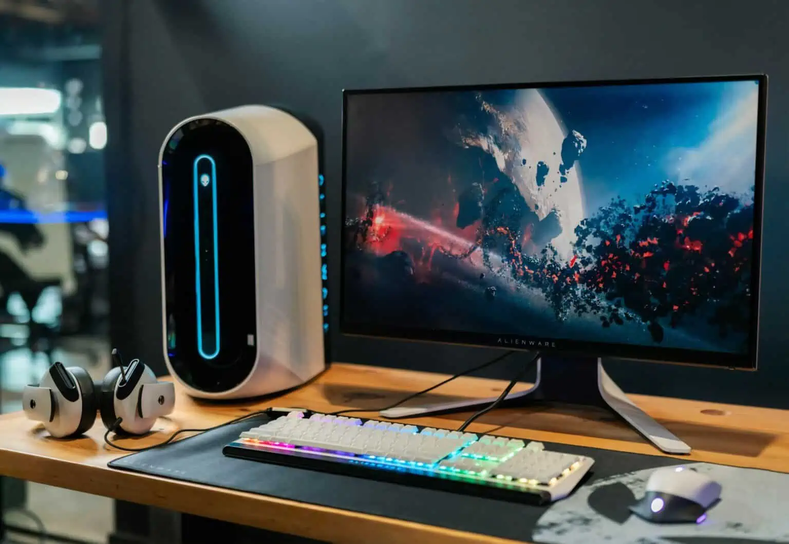 High-performance gaming computer with RGB keyboard and sleek monitor.