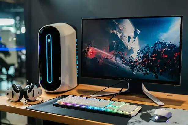 High-performance gaming computer with RGB keyboard and sleek monitor.