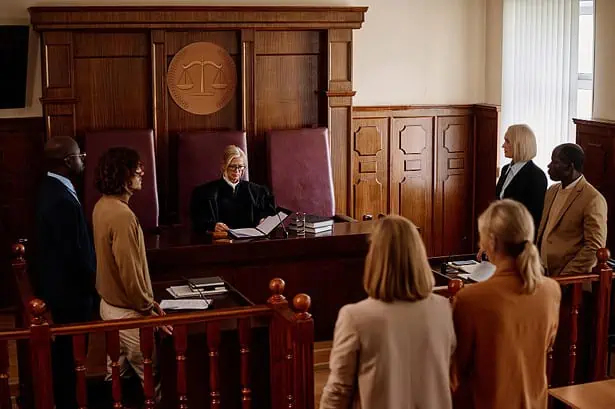 California courtroom scene with judge and attorneys.