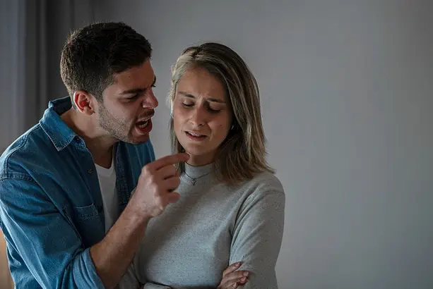 Couple arguing, seeking conflict resolution strategies.