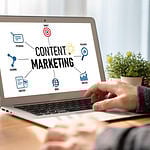 Person planning content marketing strategy on a laptop.