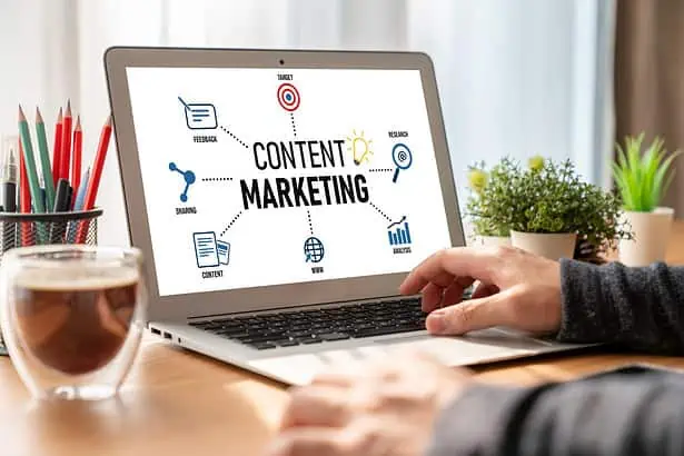 Person planning content marketing strategy on a laptop.