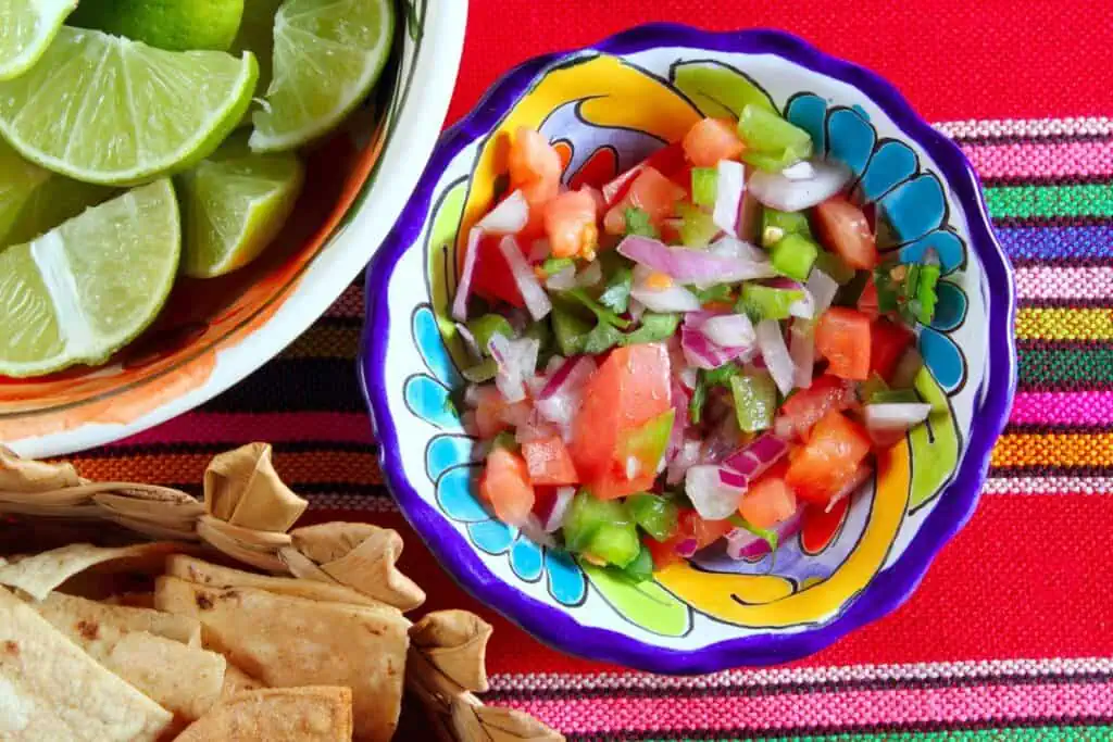 What to Eat with Taquitos? 14 Delicious Side Dishes 6 Pico de gallo tomato and chili Mexican sauce serape tablecloth