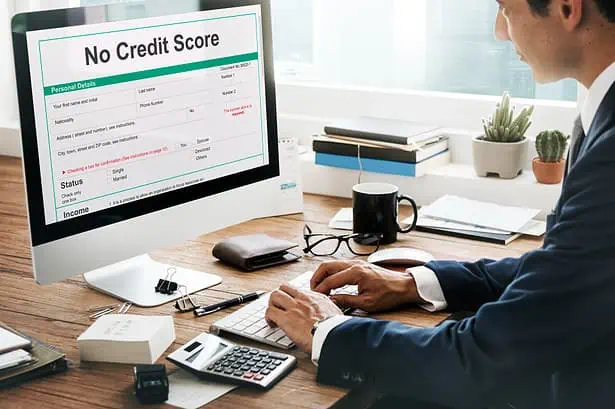 Man checking credit report on computer with 