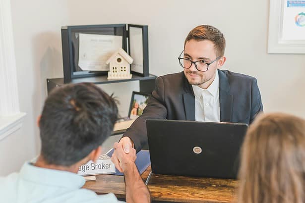Business professionals sealing deal with handshake.