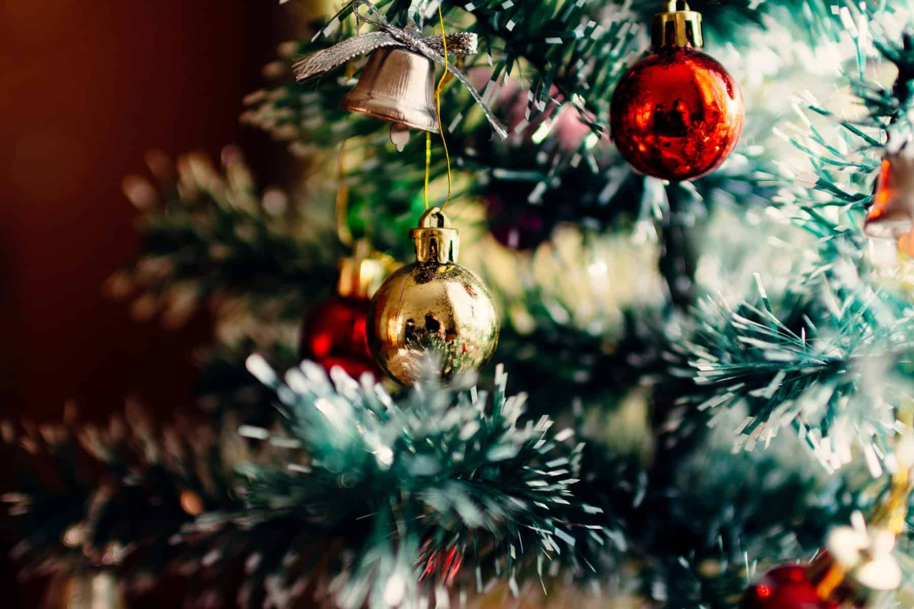 Home Icy 41 Christmas tree ornaments and decorations with red and gold baubles, festive lights, and greenery.