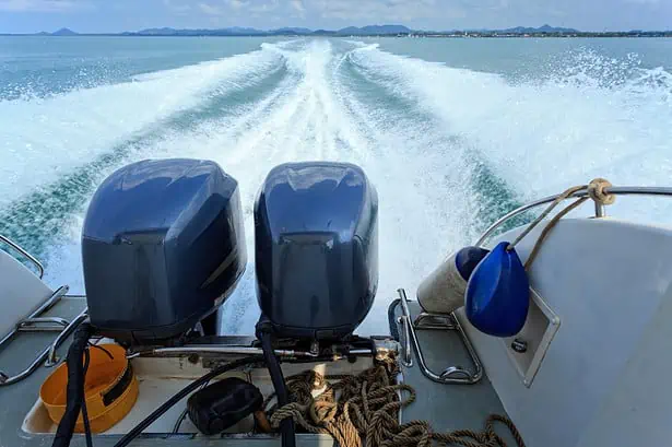 Speedboat engines powering through the water.