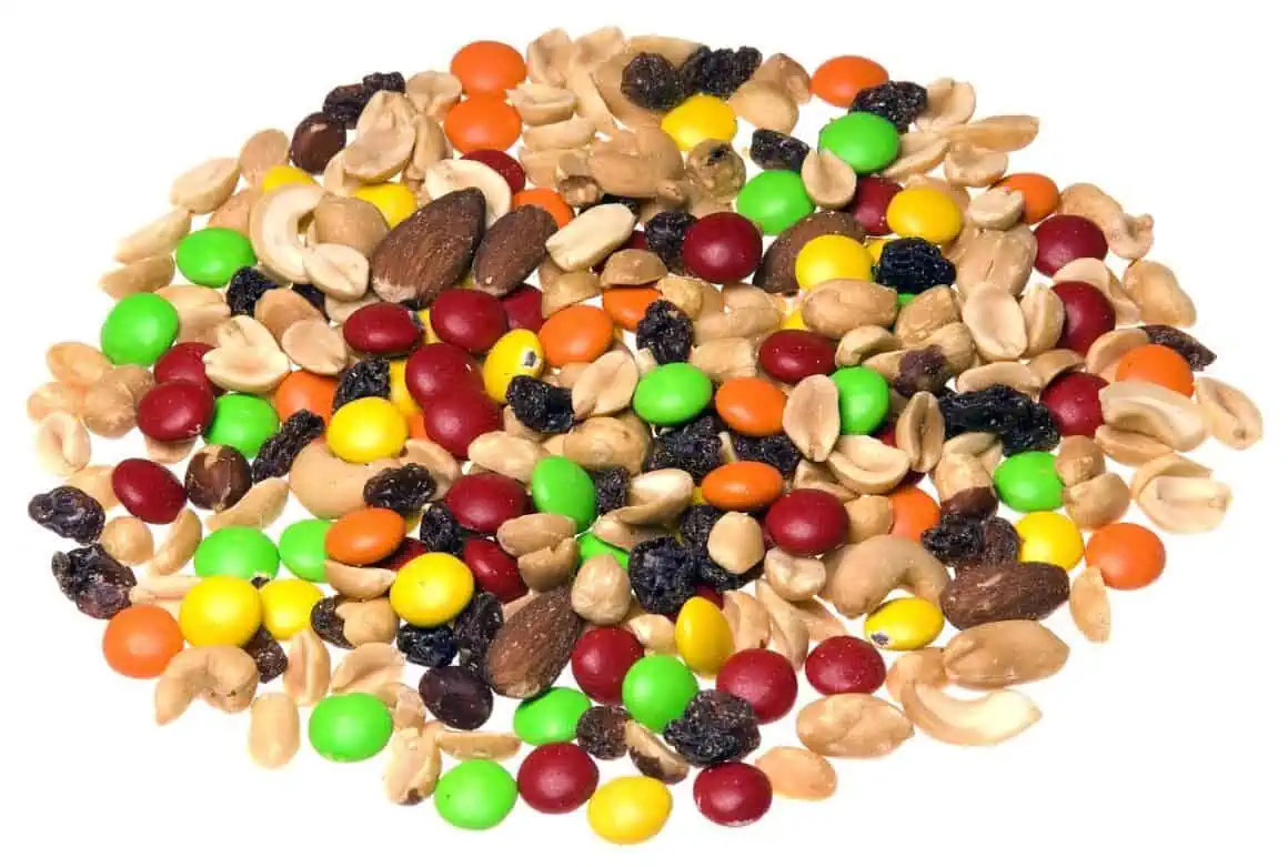 Vibrant trail mix featuring nuts, dried fruits, and colorful candies for a nutritious snack.