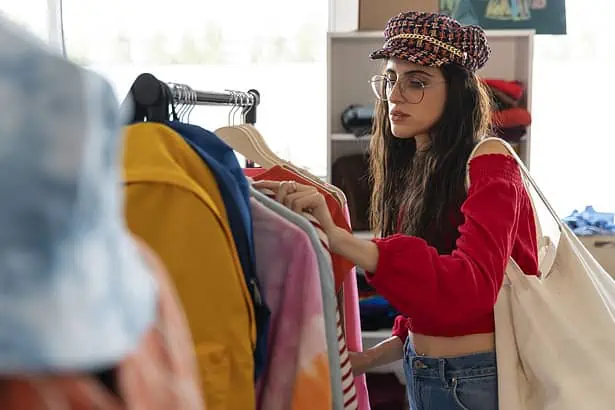Woman shopping for trendy clothes at a boutique store.