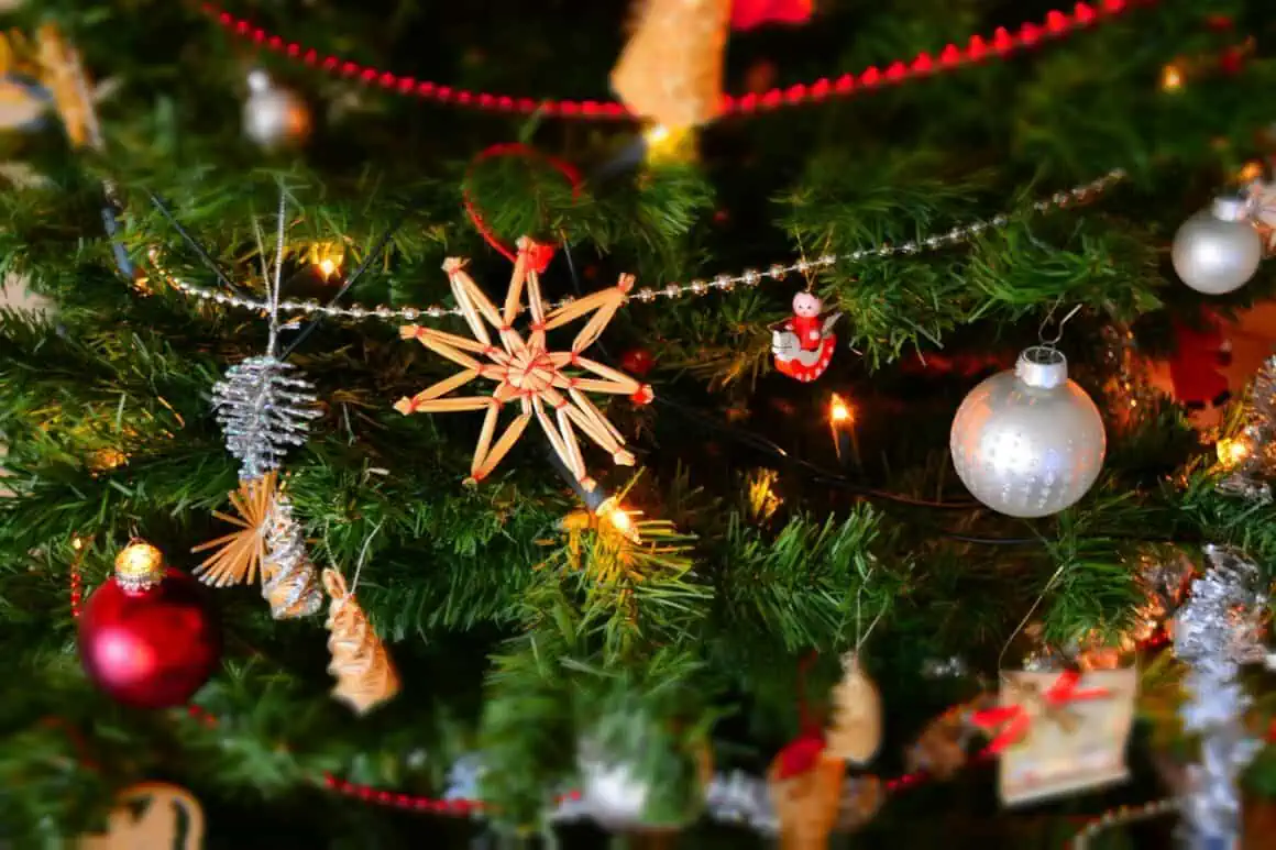 Christmas tree decorated with ornaments, lights, and festive decorations for the holiday season.
