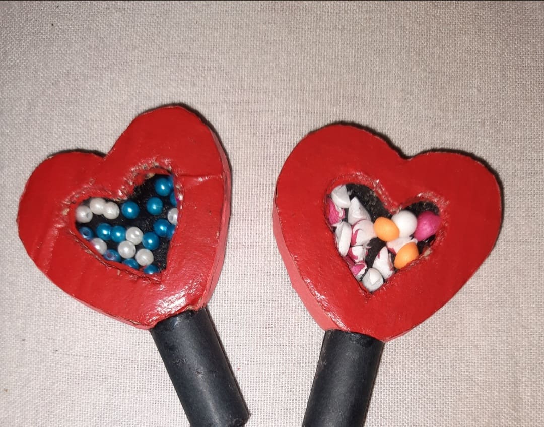 Home Icy 47 Heart-shaped candy dispensers filled with colorful candies, perfect for Valentine's Day treats.