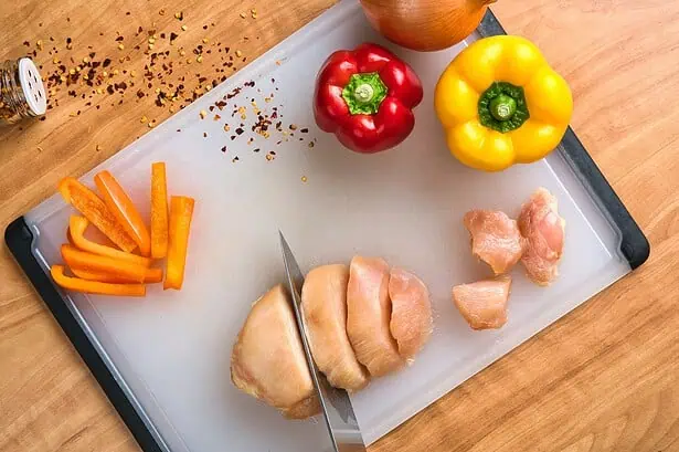 Healthy chicken meal preparation with vegetables for a nutritious diet.