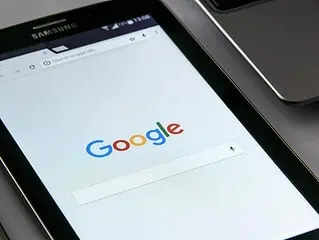 Google search engine homepage displayed on a mobile device.