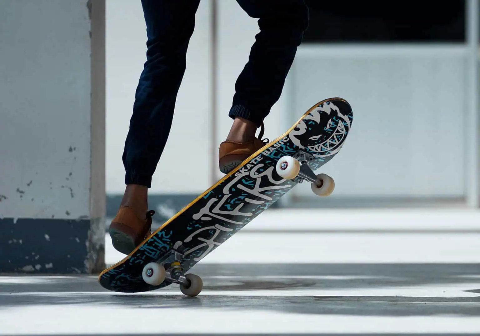 Skateboarder performing a trick on a skateboard in an urban setting.