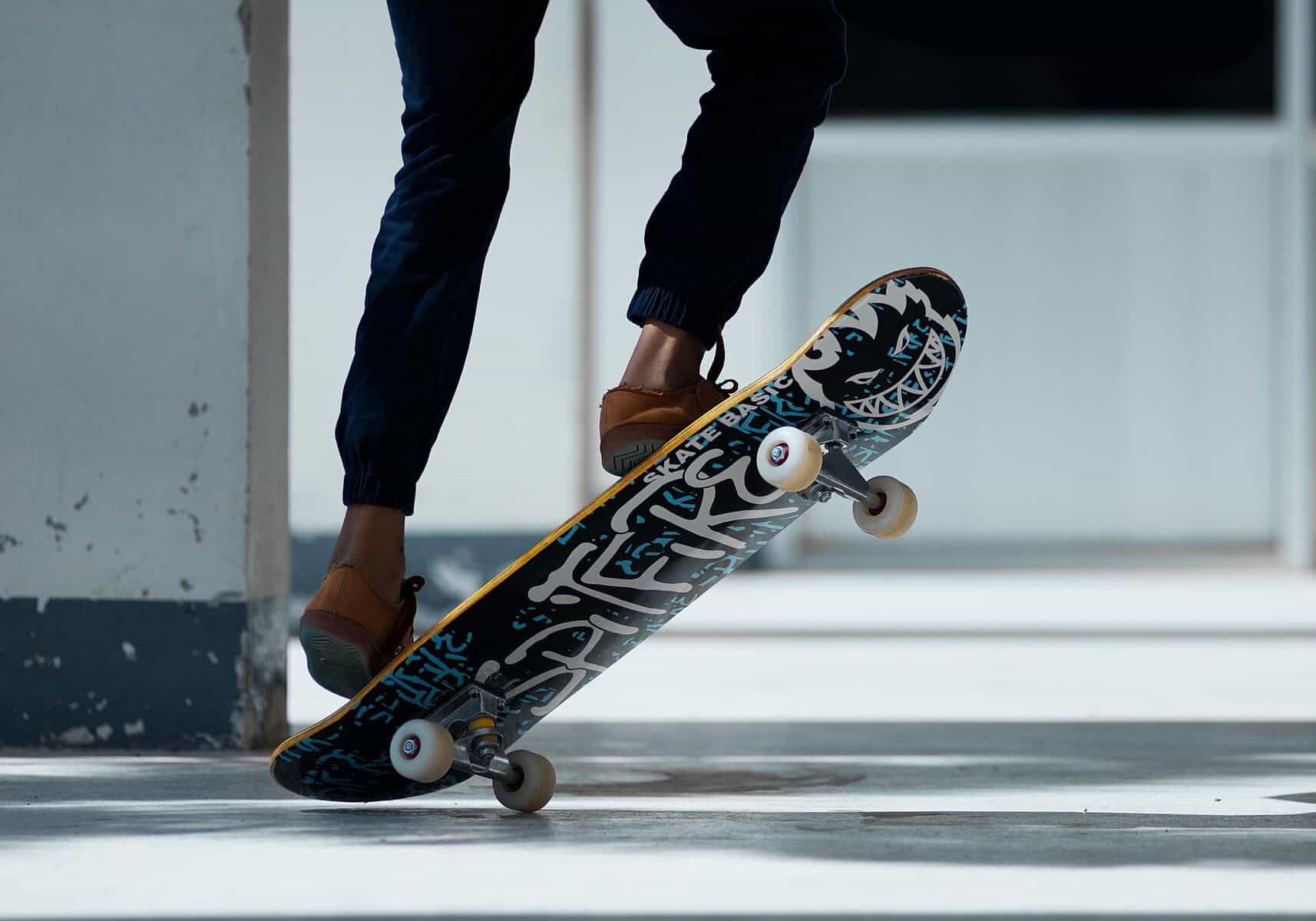 Skateboarder performing a trick on a skateboard in an urban setting.