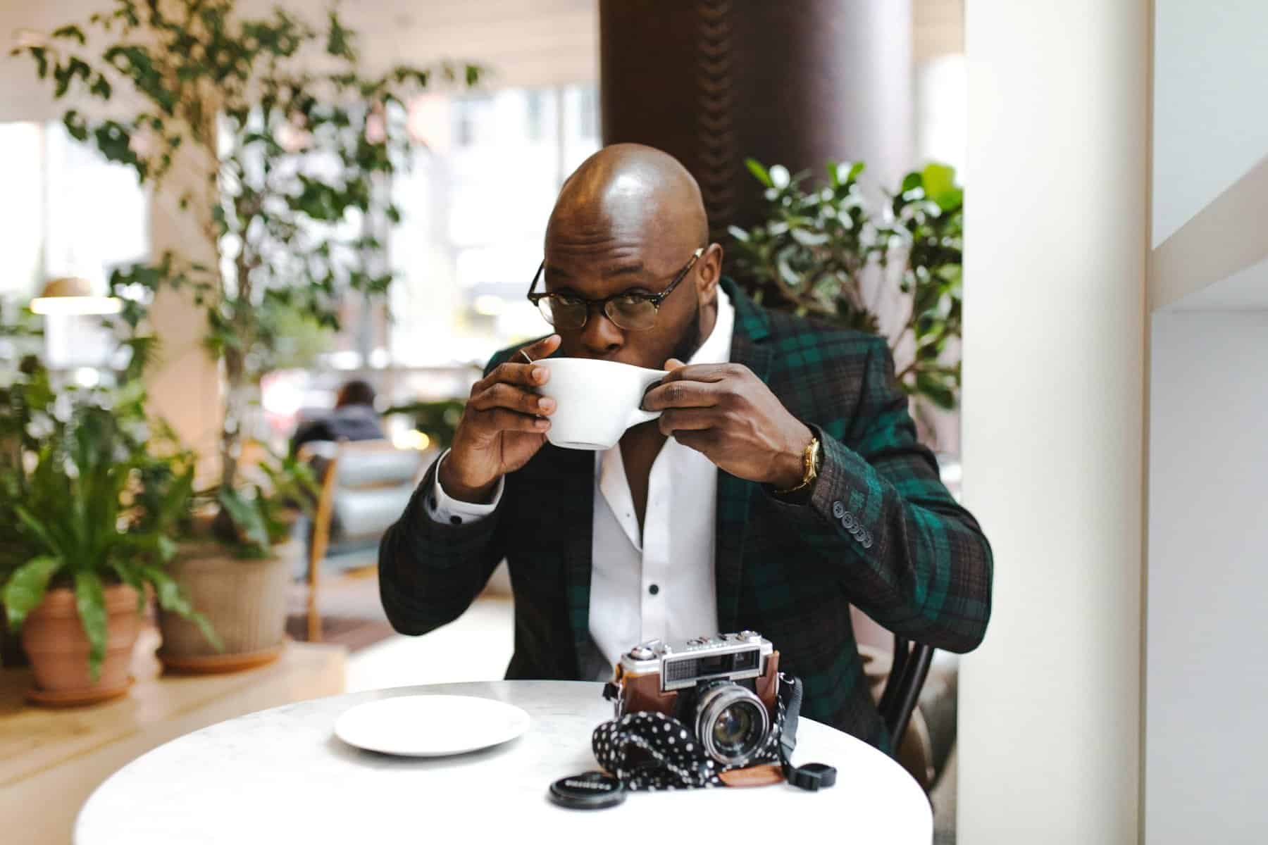 Home Icy 41 Enjoy a rich coffee in a stylish cafe setting with natural light and greenery.