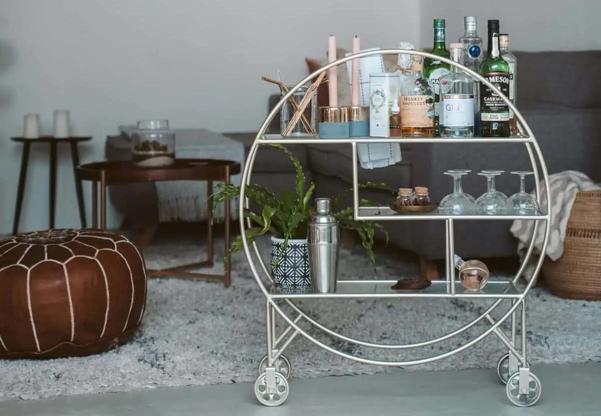 Home Icy 40 Stylish bar cart featuring bottles, glasses, and bar accessories in a modern living room setting.