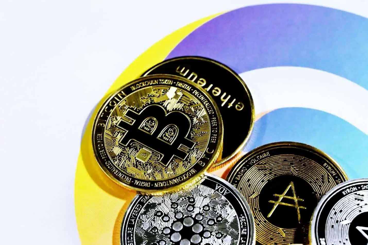 Bitcoin is navigating its strongest rally yet 2 a pile of bitcoins sitting on top of each other