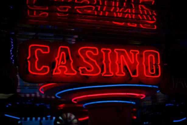Neon casino sign illuminated at night with vibrant red and blue neon lights.