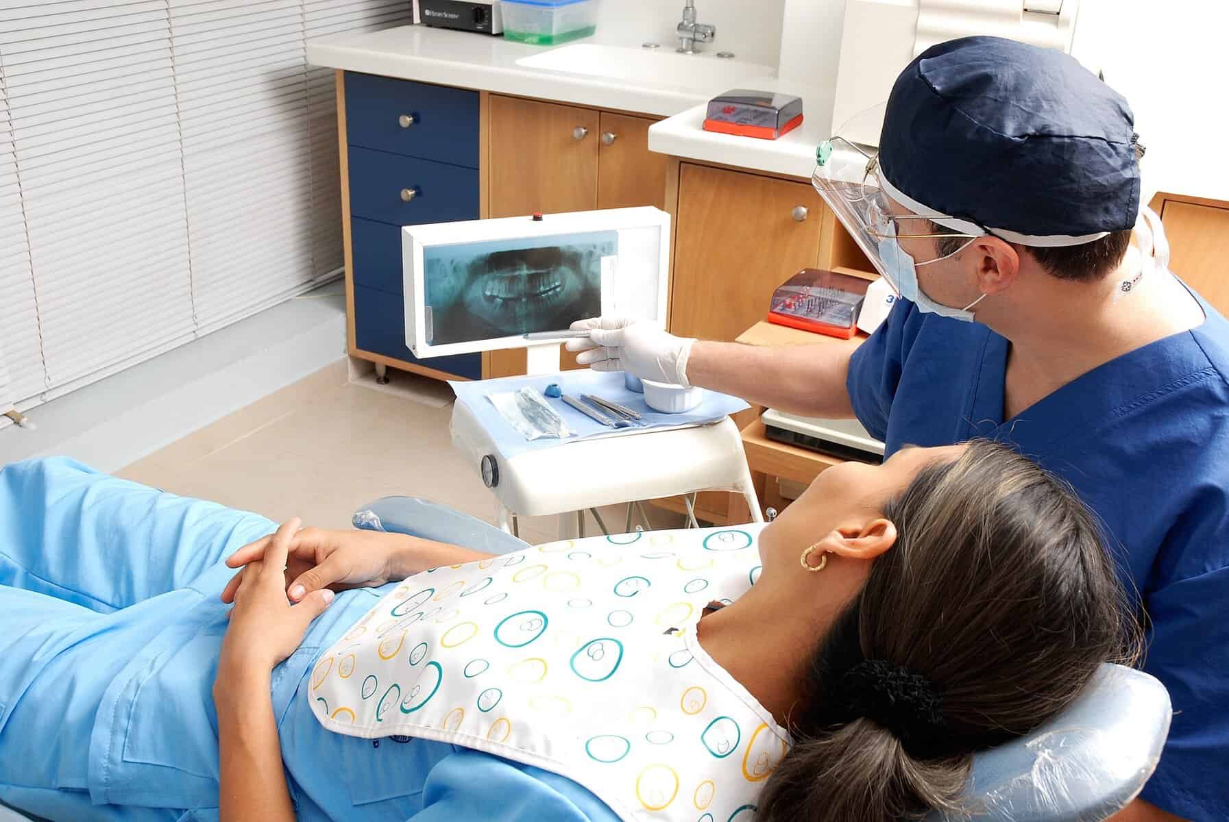 High-quality dental X-ray being examined by a dentist for treatment planning.