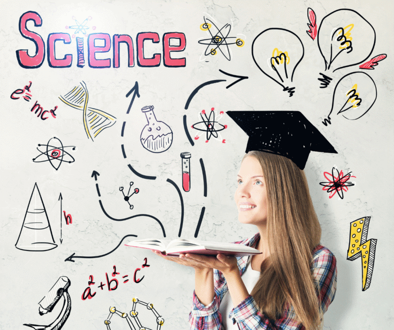 Young girl with graduation cap exploring science concepts.
