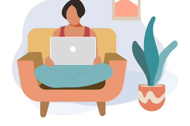 Woman working on laptop at home with plants and art.