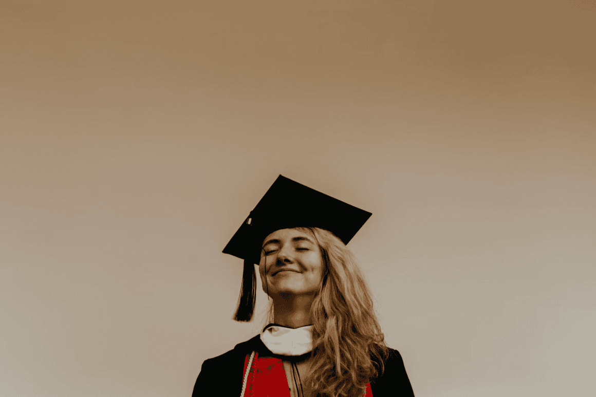 Graduation cap and gown celebration of a young woman.